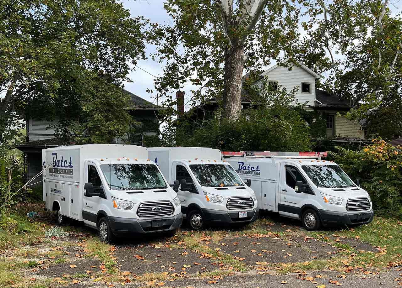 Trucks from Bates Electric lined up in lot