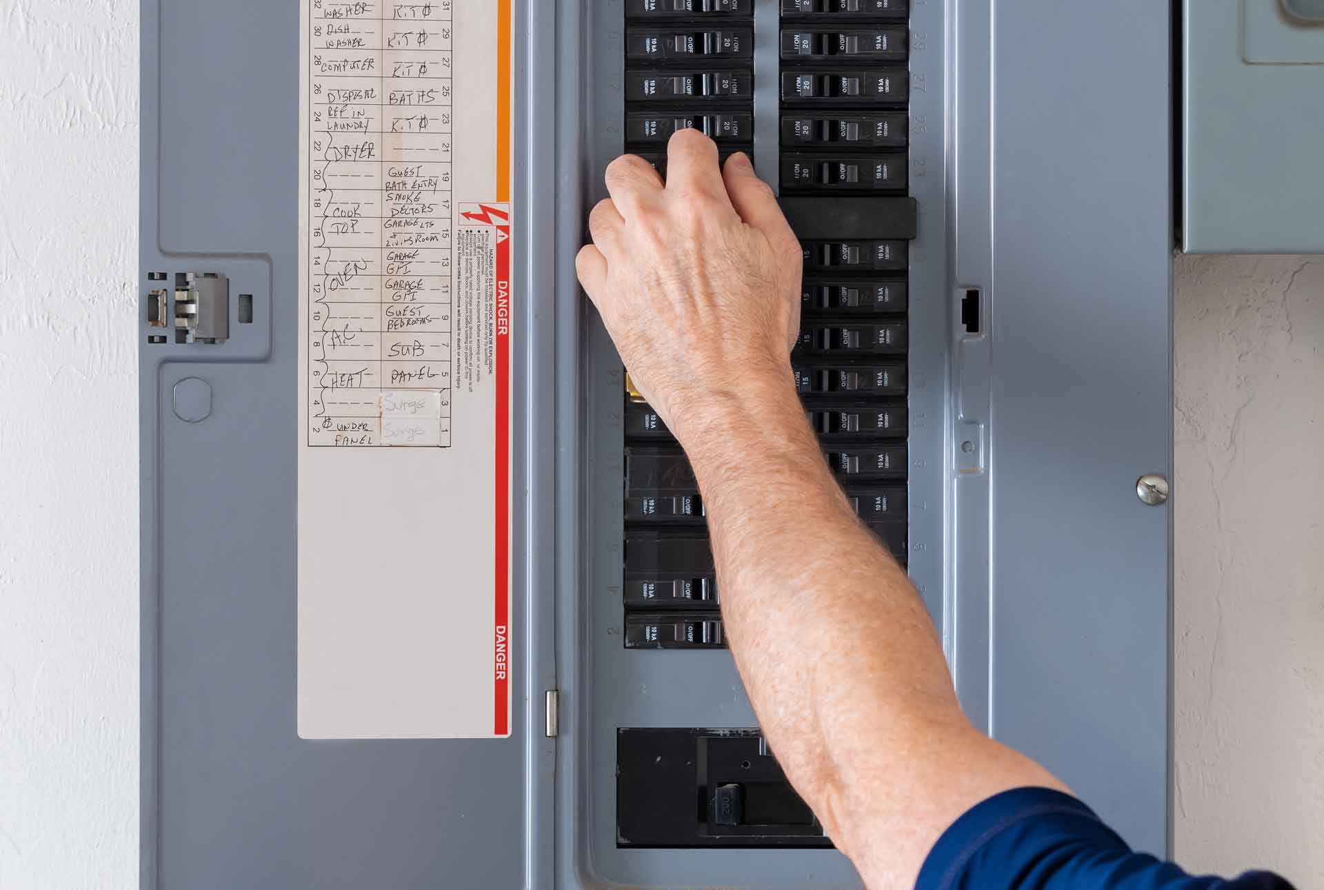 Man at work on electrical panel