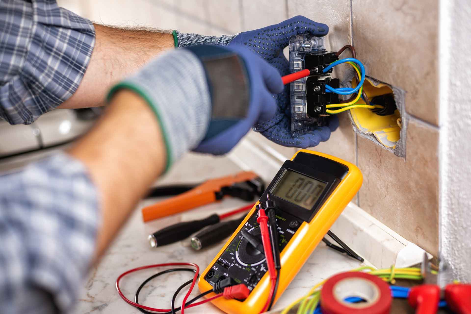 Electrician installing an outlet