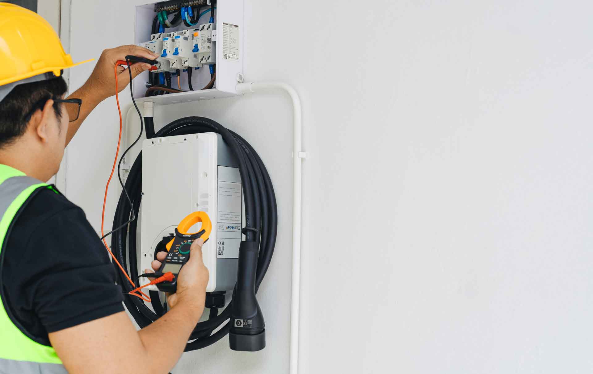 Electrician installing an EV charger